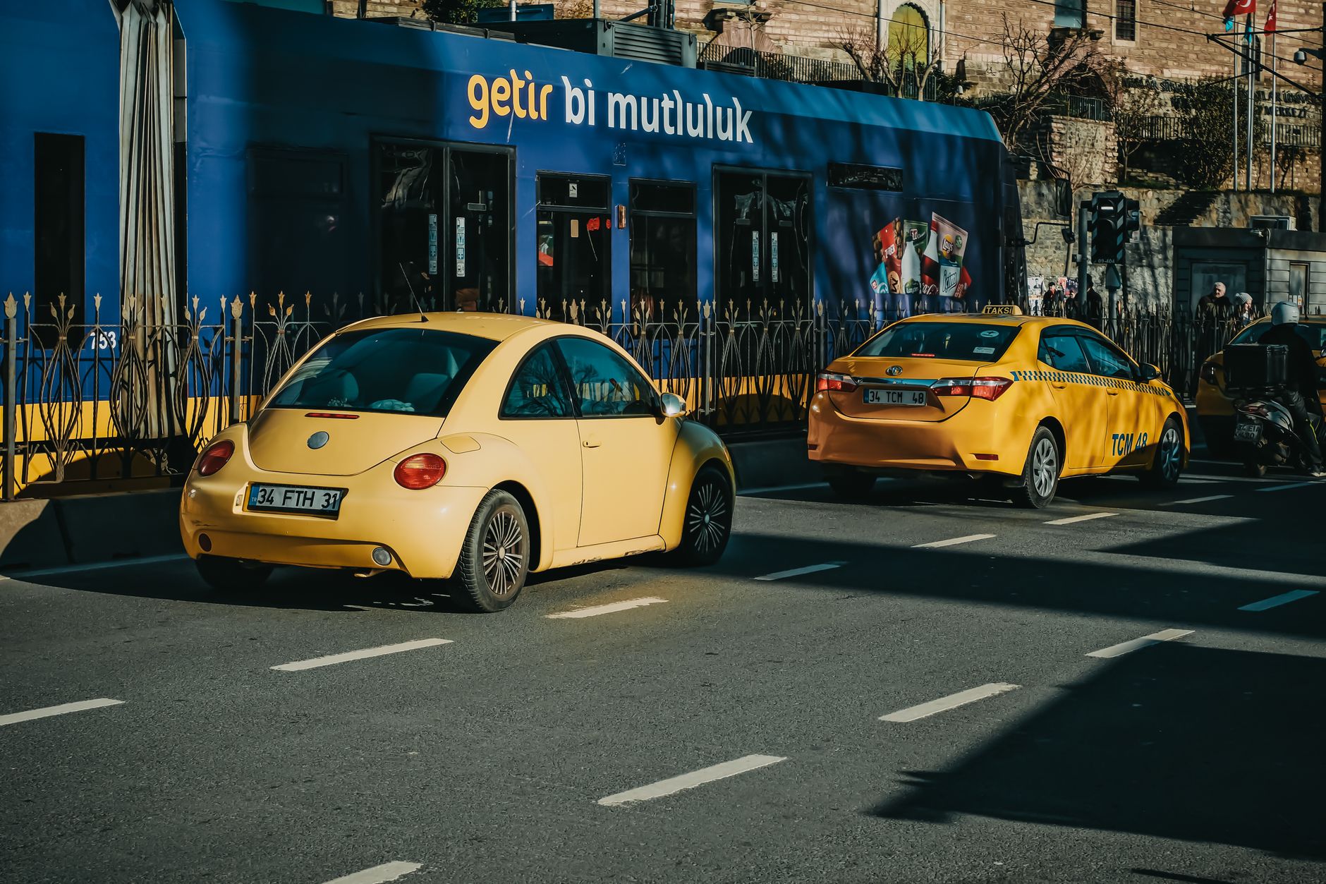 Official municipal yellow taxis in Istanbul traffic