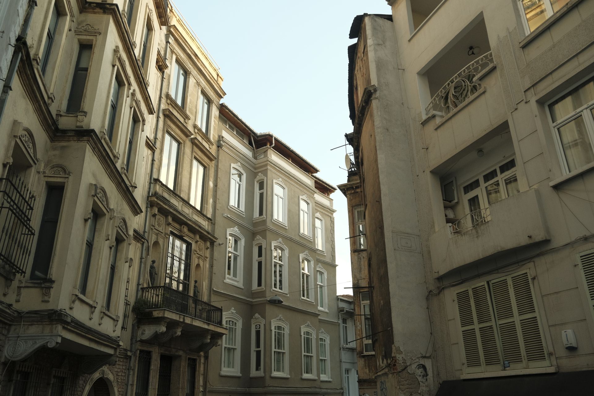 Charming historic streetscape in Beyoglu flanked by heritage European-style architecture and paved roadways near Tepebasi.