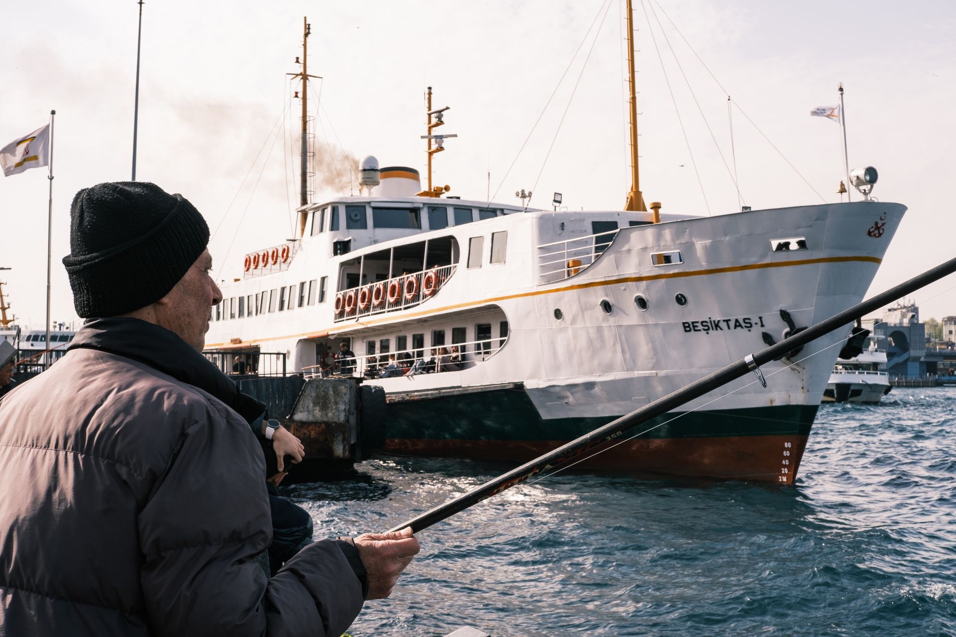 Bustling maritime waterfront scene at Beşiktaş ferry terminal and square adjacent to Shangri-La Bosphorus.